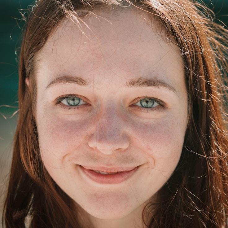 Alex Chen, Lead Design Curator at CellarMillStudio, reviewing corporate floral arrangements